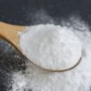 Sodium bicarbonate in a wooden spoon