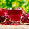 glass of pomegranate  juice with fresh fruits